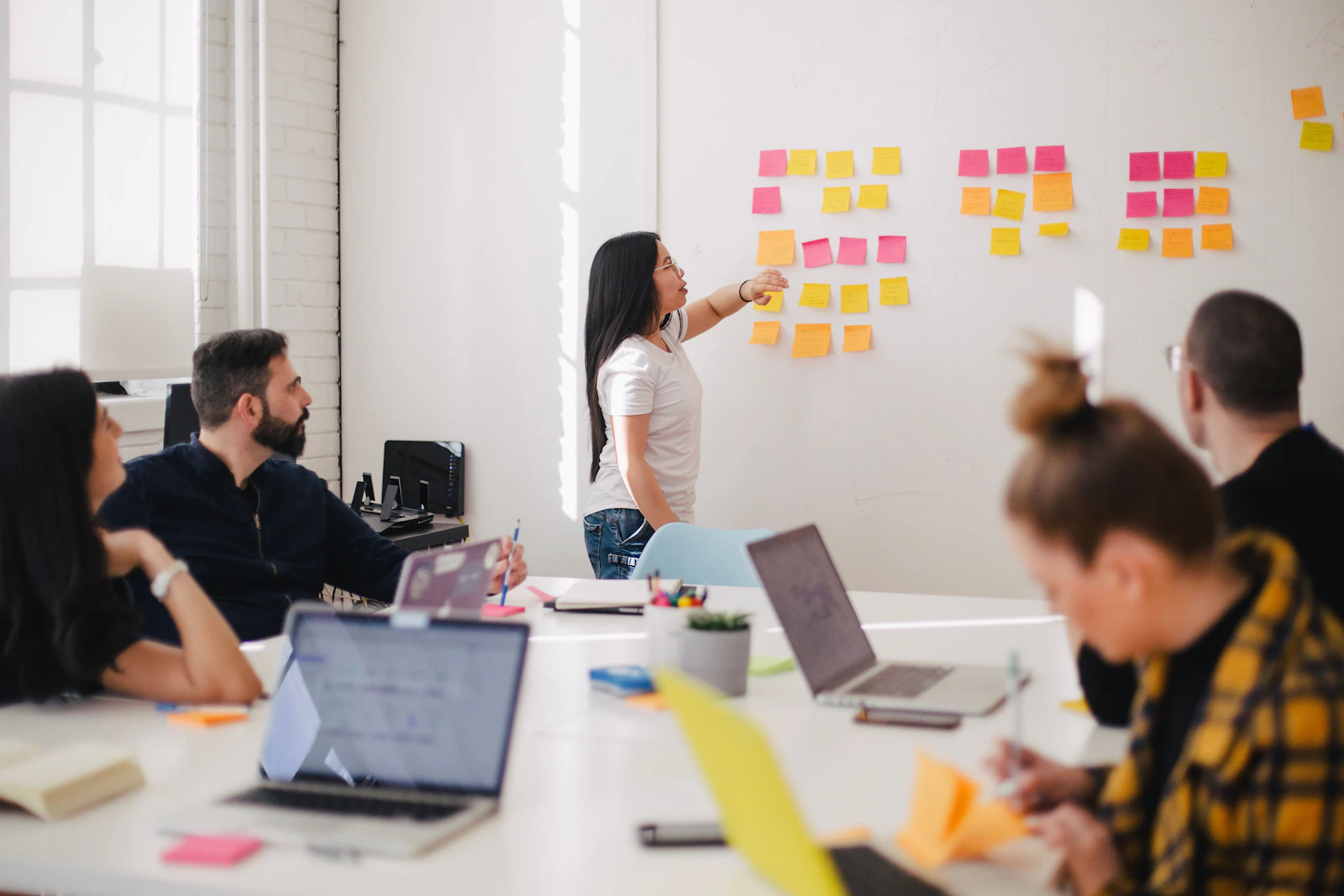 A team mapping out ideas together in a bright office