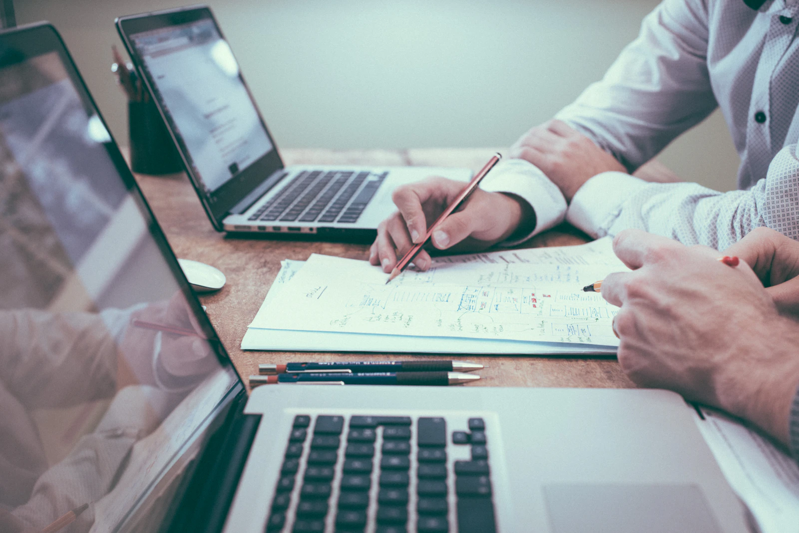 Two people reviewing a growth plan at a desk